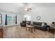 Living room with vaulted ceiling, tiled floors, and comfy seating at 3348 Merganser Dr., Conway, SC 29527