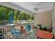 Screened porch with outdoor furniture, ceiling fan, and access to backyard at 3348 Merganser Dr., Conway, SC 29527