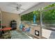 Relaxing screened porch with seating area and view of backyard at 3348 Merganser Dr., Conway, SC 29527