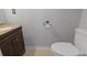 Simple yet functional half bathroom with dark brown vanity at 394 Blackberry Ln., Myrtle Beach, SC 29579