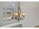 Ornate chandelier hanging in the stairwell, adding elegance to the home at 394 Blackberry Ln., Myrtle Beach, SC 29579