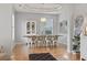 Farmhouse-style dining room with a wooden table and white chairs at 394 Blackberry Ln., Myrtle Beach, SC 29579