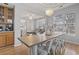 Bright dining area with a wooden table and white metal chairs at 394 Blackberry Ln., Myrtle Beach, SC 29579