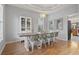 Farmhouse-style dining room with a wooden table and white chairs at 394 Blackberry Ln., Myrtle Beach, SC 29579