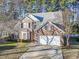 Brick two-story house with a two-car garage and landscaped yard at 394 Blackberry Ln., Myrtle Beach, SC 29579