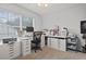 Well-lit home office with two desks, ample storage, and a printer at 394 Blackberry Ln., Myrtle Beach, SC 29579