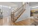 Elegant staircase with wood railings leading to the upper level at 394 Blackberry Ln., Myrtle Beach, SC 29579