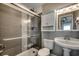Bathroom with a walk-in shower and pedestal sink at 400 N Waccamaw Dr. # 304, Garden City Beach, SC 29576