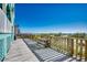 Beachfront wooden deck with picnic table and ocean views at 400 N Waccamaw Dr. # 304, Garden City Beach, SC 29576