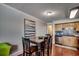 Kitchen and dining area with wooden table and chairs at 400 N Waccamaw Dr. # 304, Garden City Beach, SC 29576