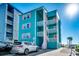 Beachfront teal building exterior at 400 N Waccamaw Dr. # 304, Garden City Beach, SC 29576