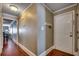Light-colored hallway with wood floors, leading to other rooms at 400 N Waccamaw Dr. # 304, Garden City Beach, SC 29576