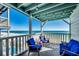 Relaxing balcony overlooking the ocean with comfortable seating at 400 N Waccamaw Dr. # 304, Garden City Beach, SC 29576