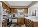 Cozy kitchen featuring wood cabinets and essential appliances at 409 77Th Ave. N # B, Myrtle Beach, SC 29572