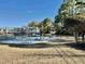 Outdoor basketball court with picnic tables and grassy surroundings at 4273 Santolina Way # E, Murrells Inlet, SC 29576
