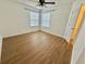Bedroom with wood-look floors, a ceiling fan, and a double window for plenty of light at 4273 Santolina Way # E, Murrells Inlet, SC 29576