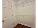 Walk-in closet with wood-look floors and wire shelving for added storage at 4273 Santolina Way # E, Murrells Inlet, SC 29576