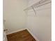Walk-in closet with wood-look floors and a shelf for added storage at 4273 Santolina Way # E, Murrells Inlet, SC 29576