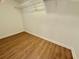 Walk-in closet with wood-look floors, neutral wall color, and plenty of space at 4273 Santolina Way # E, Murrells Inlet, SC 29576