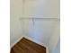 Walk-in closet with wood-look floors and a shelf for added storage at 4273 Santolina Way # E, Murrells Inlet, SC 29576