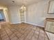 Dining area with tile flooring, chandelier lighting, and built-in shelving at 4273 Santolina Way # E, Murrells Inlet, SC 29576