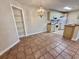 Dining area with tile flooring and kitchen featuring classic cabinetry and modern appliances at 4273 Santolina Way # E, Murrells Inlet, SC 29576