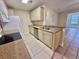 Kitchen featuring stainless steel appliances, breakfast bar, and tiled flooring at 4273 Santolina Way # E, Murrells Inlet, SC 29576