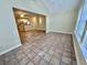 Spacious living room with tile flooring, natural light, and open floor plan leading to the kitchen at 4273 Santolina Way # E, Murrells Inlet, SC 29576