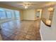 Open-concept living room featuring tile flooring, neutral walls, ceiling fan, and abundant natural light at 4273 Santolina Way # E, Murrells Inlet, SC 29576