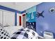 Bright bedroom with a double bed and blue walls at 500 Fairway Village Dr. # 1-O, Myrtle Beach, SC 29588