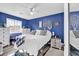 Bedroom with double bed, blue walls, and decorative accents at 500 Fairway Village Dr. # 1-O, Myrtle Beach, SC 29588