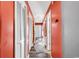 Bright coral hallway with wood-look floors and access to other rooms at 500 Fairway Village Dr. # 1-O, Myrtle Beach, SC 29588