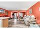 Open living room and kitchen with coral walls and wood-look floors at 500 Fairway Village Dr. # 1-O, Myrtle Beach, SC 29588
