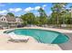 Community pool with lounge chair and surrounding fence at 500 Fairway Village Dr. # 1-O, Myrtle Beach, SC 29588