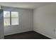 Simple bedroom with window and neutral-colored carpet at 5001 Little River Rd. # W-402, Myrtle Beach, SC 29577