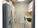 Kitchen with white cabinets, appliances, and double sink at 5001 Little River Rd. # W-402, Myrtle Beach, SC 29577