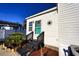 White exterior with teal door, steps, and landscaping at 505 Rainbow Dr., Garden City Beach, SC 29576