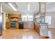 Kitchen with stainless steel appliances and wood cabinets at 505 Rainbow Dr., Garden City Beach, SC 29576