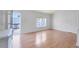 Bright living room with hardwood floors and access to patio at 505 Rainbow Dr., Garden City Beach, SC 29576