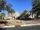 Brick home with landscaped yard, three-car garage, and palm trees at 5407 Pheasant Dr., North Myrtle Beach, SC 29582