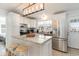 Kitchen with white cabinets, granite island, and stainless steel appliances at 5607 N N Ocean Blvd., North Myrtle Beach, SC 29582