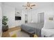 Serene bedroom with a ceiling fan, ample closet space, and a TV at 5750 Oyster Catcher Dr. # 1124, North Myrtle Beach, SC 29582