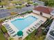 Community pool with ample lounge chairs at 5750 Oyster Catcher Dr. # 1124, North Myrtle Beach, SC 29582