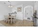 Bright dining area with hardwood floors and chandelier at 5750 Oyster Catcher Dr. # 1124, North Myrtle Beach, SC 29582