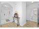 Clean entryway with tile flooring, a console table, and access to bathroom at 5750 Oyster Catcher Dr. # 1124, North Myrtle Beach, SC 29582
