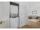 Convenient laundry closet with stacked washer and dryer at 5750 Oyster Catcher Dr. # 1124, North Myrtle Beach, SC 29582