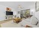 Spacious living room features hardwood floors, access to balcony, and ample natural light at 5750 Oyster Catcher Dr. # 1124, North Myrtle Beach, SC 29582