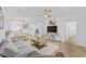 Bright living room with hardwood floors, comfy seating, and a large TV at 5750 Oyster Catcher Dr. # 1124, North Myrtle Beach, SC 29582