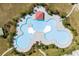 Aerial view of a unique shaped community pool at 5750 Oyster Catcher Dr. # 1124, North Myrtle Beach, SC 29582