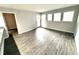 Spacious living room with grey vinyl plank flooring and access to a patio at 5905 S Kings Hwy. # 4112, Myrtle Beach, SC 29575